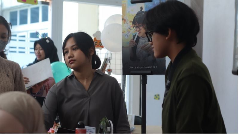 The Perfume Booth was surrounded by students taking part in the exhibition.